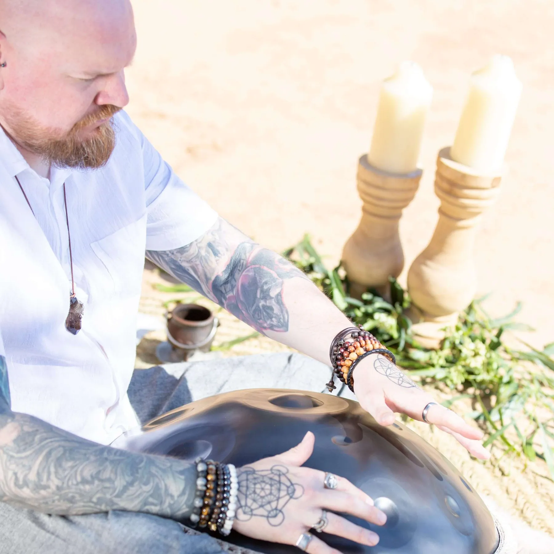 Mojave Sky Hawk playing handpan during a sound healing session